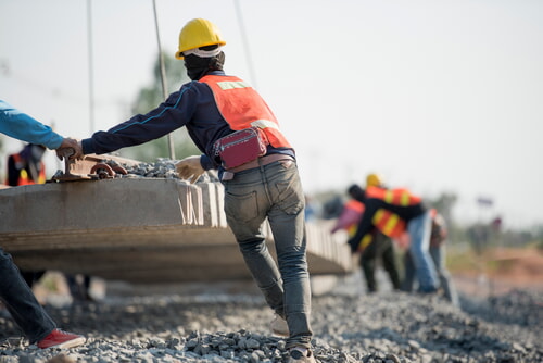 construction workers wearing high visibility clothing on a job site