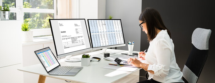 female accountant balancing her books using accounting software