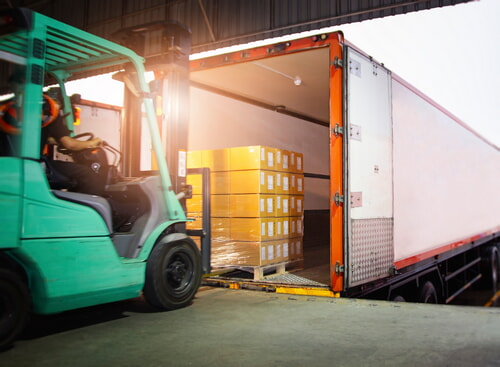 loading a pallet of inventory onto a truck trailer