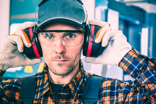 man wearing ear protection while he is working