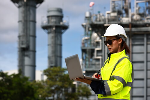 female oil and gas worker wearing proper safety gear