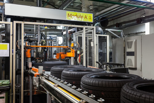 tire manufacturer producing new tires on a production line